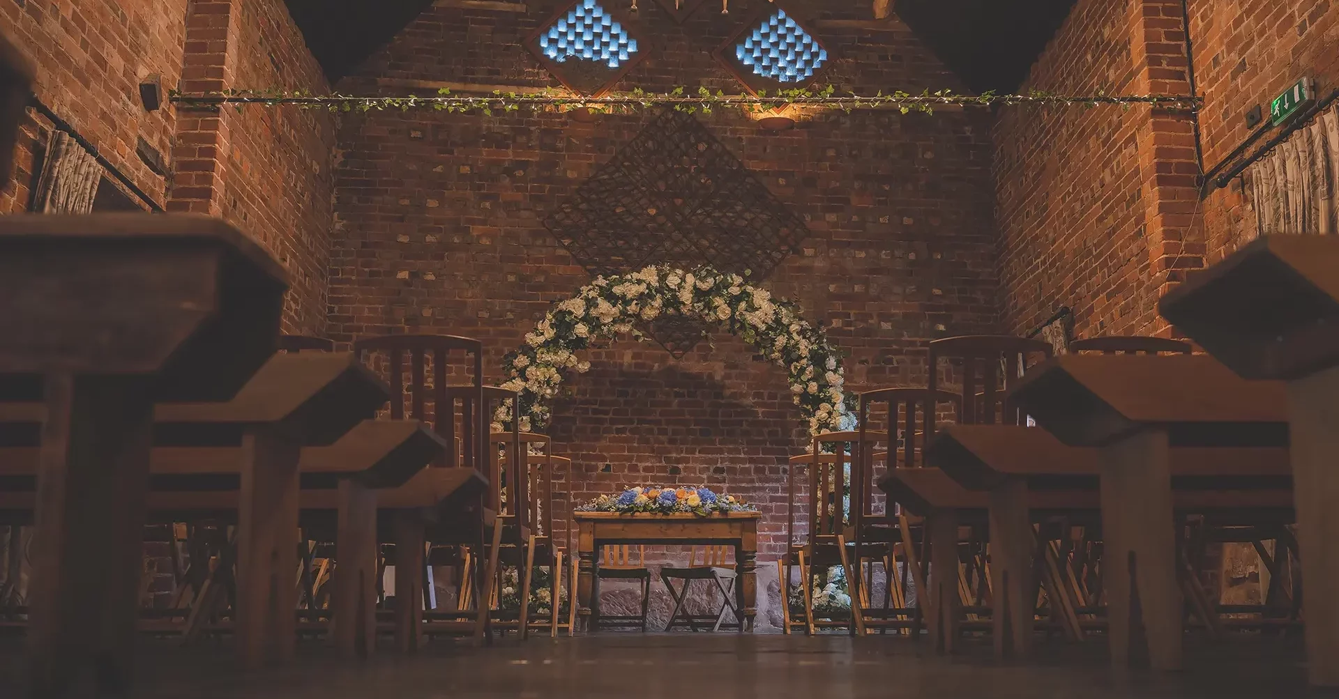 Curradine Barns floral archway wedding decor